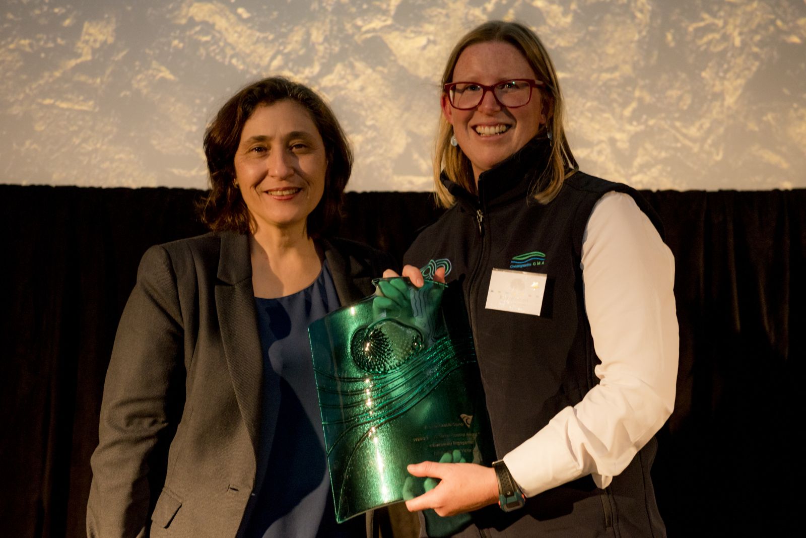 Rose Herben accepts the award on behalf of EstuaryWatch Victoria