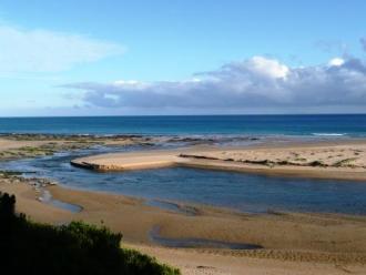 Barham River Mouth, Photo 5 : River Mouth after being scoured out  to the rock platform by floodwaters.