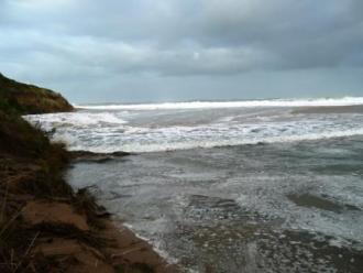 Photo 1 at base of Pt Bunbury: Wave coming in the river mouth.